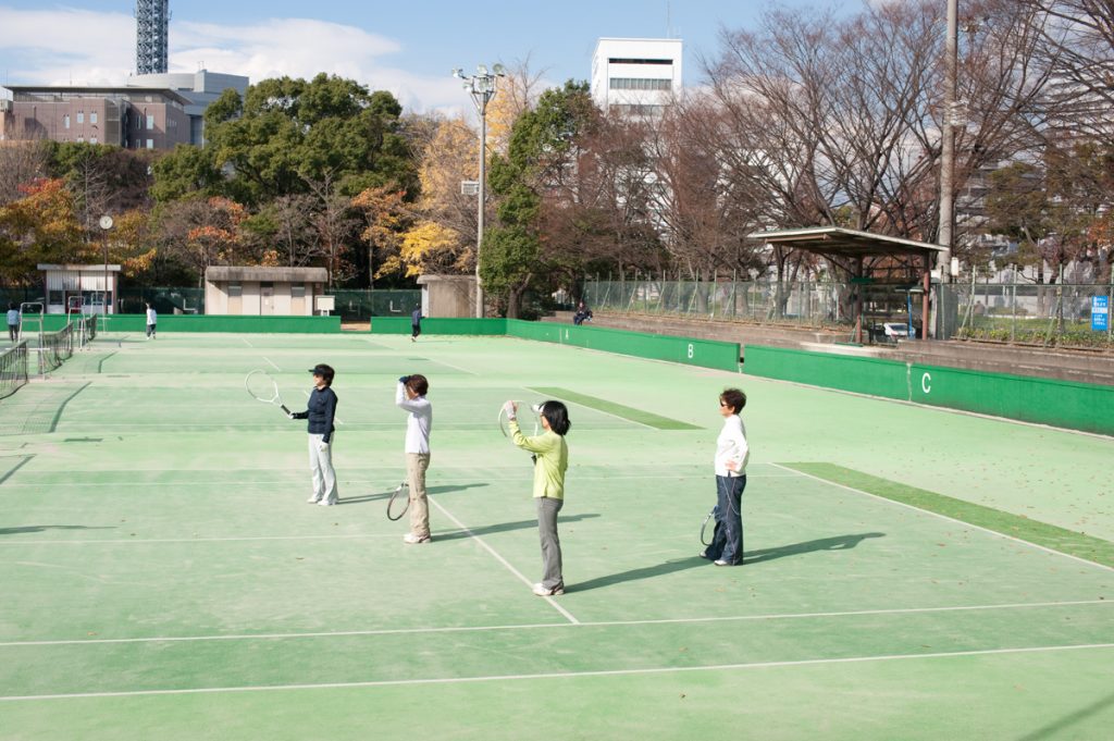 A group of women play tennis in Nagoya